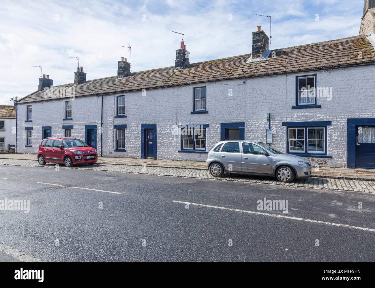 Row of white painted terraced houses in Middleton in Teesdale,England