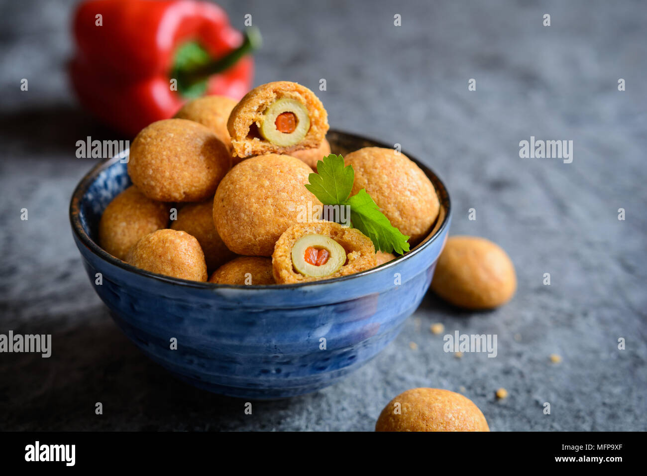 Baked green olives coated in cheese and paprika dough Stock Photo Alamy