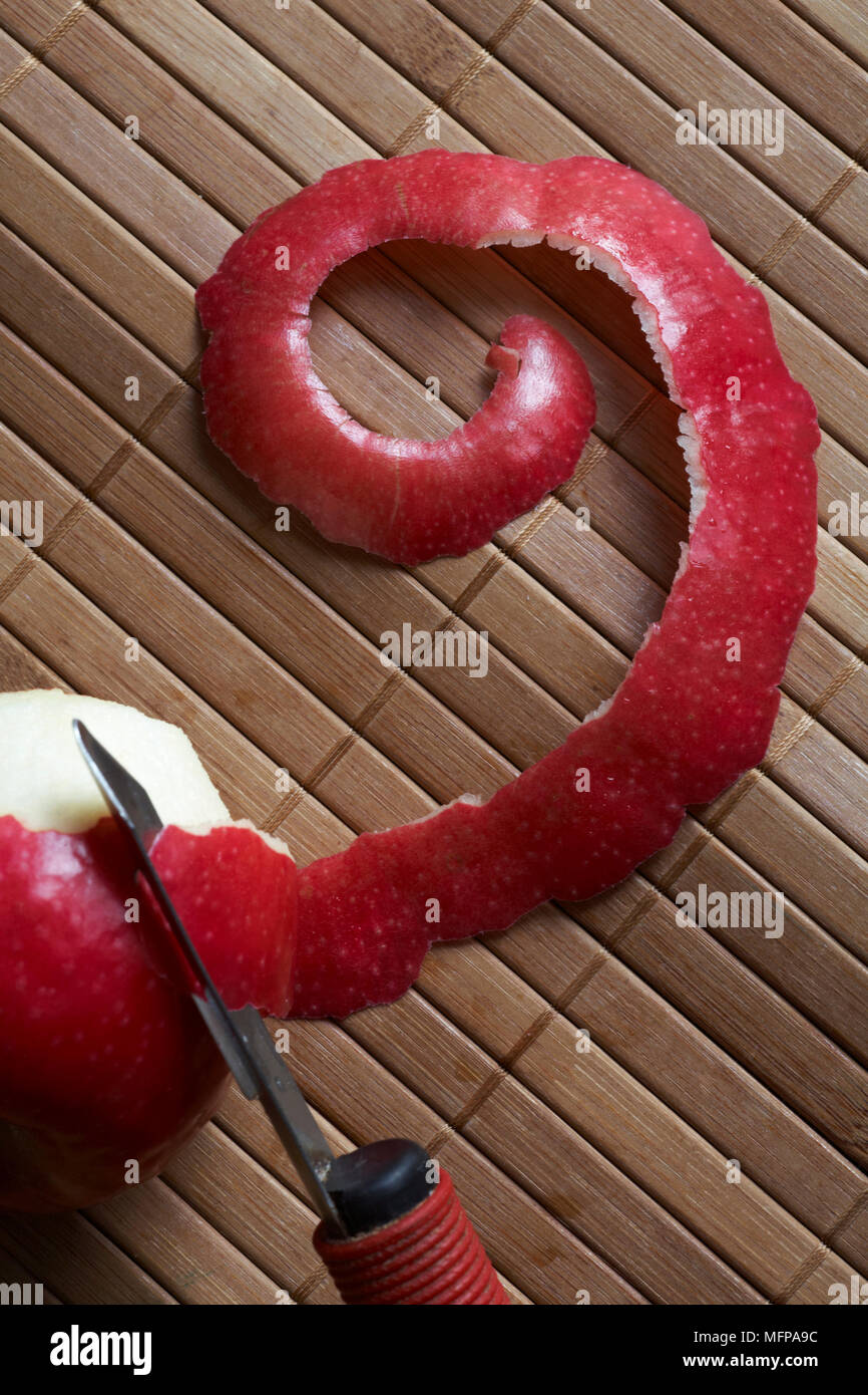 https://c8.alamy.com/comp/MFPA9C/number-9-shiny-red-apple-skin-with-apple-and-peeler-MFPA9C.jpg