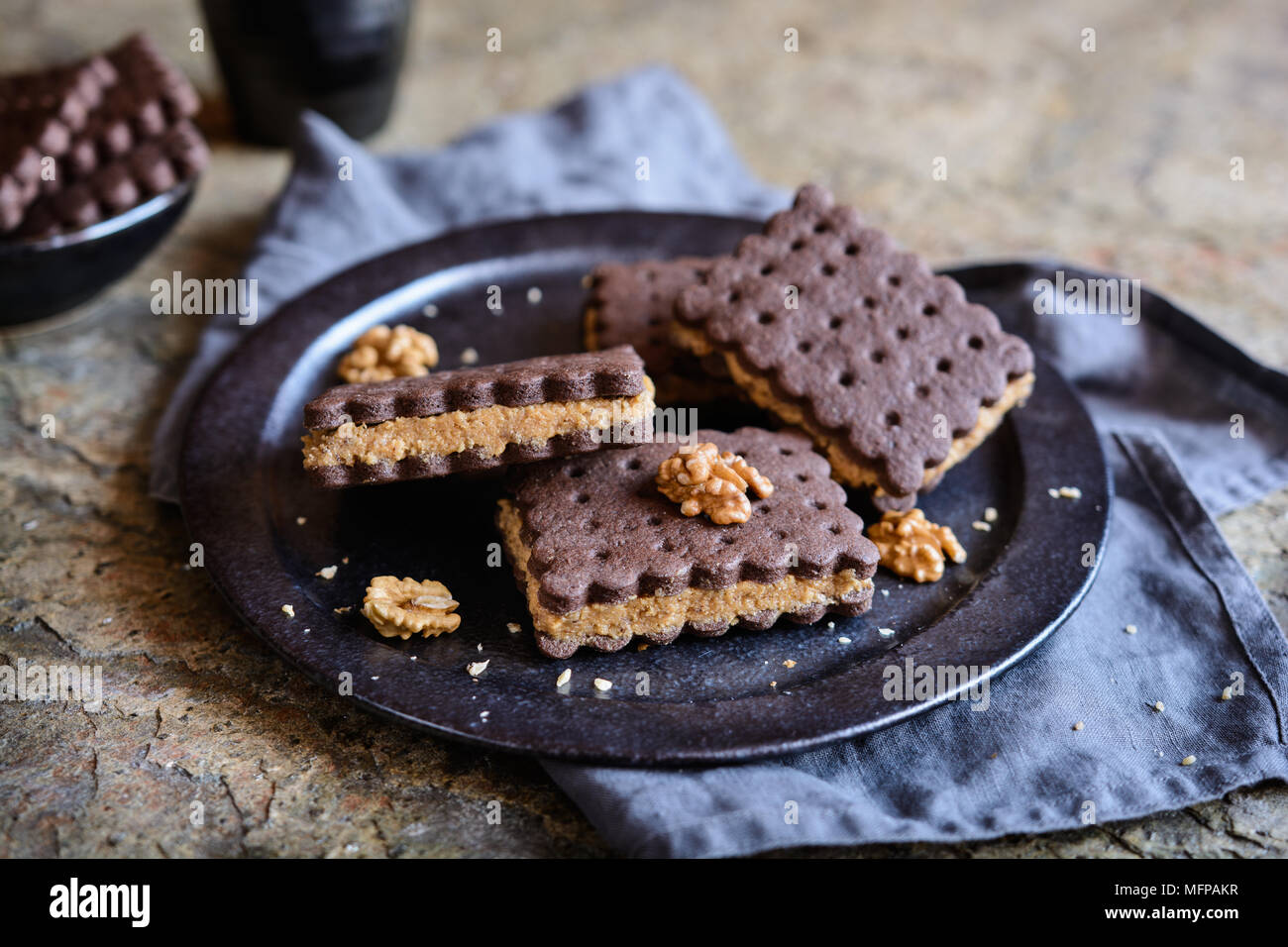 Delicious cocoa sandwich biscuits stuffed with walnut and coffee