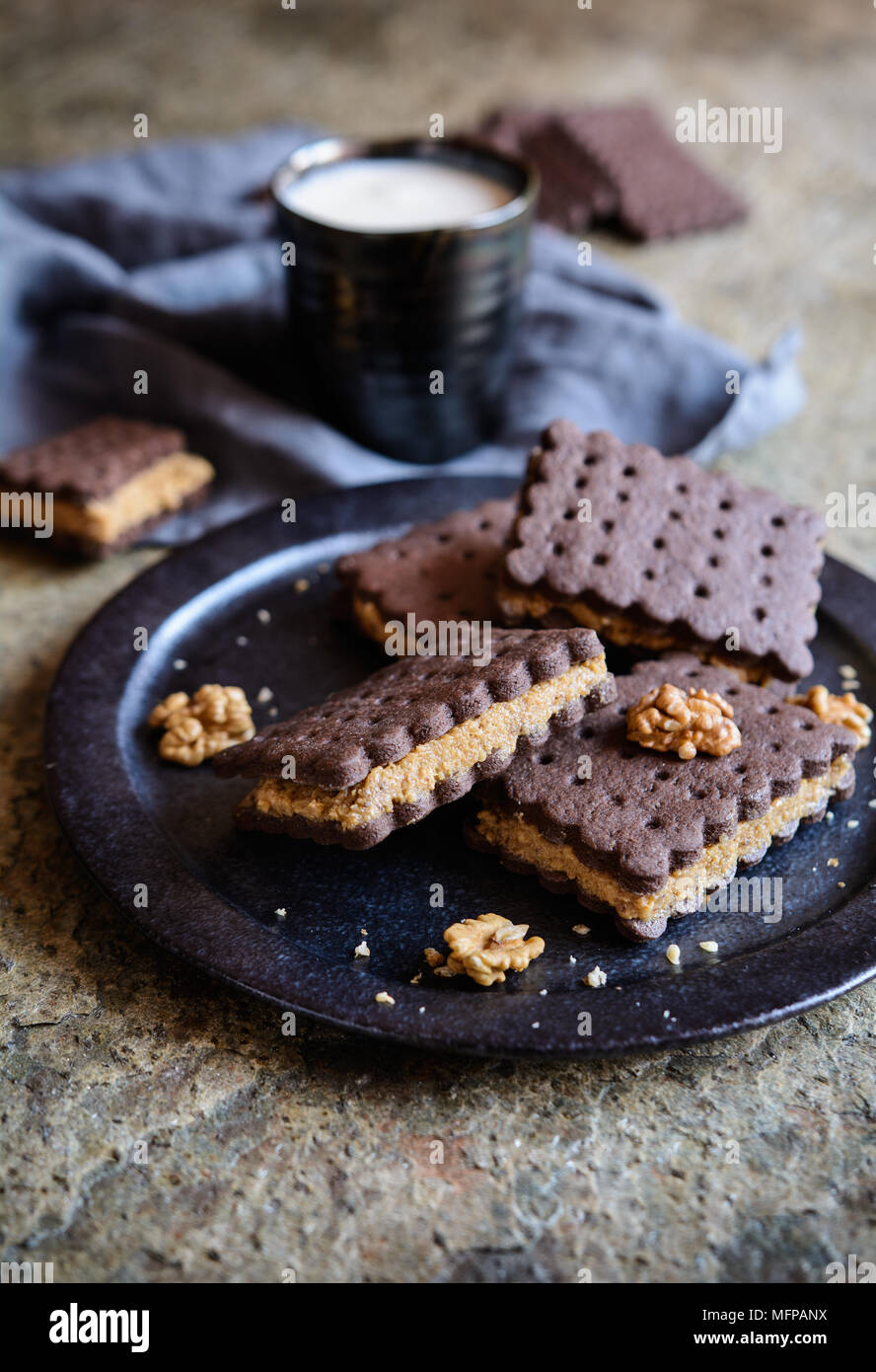 Delicious cocoa sandwich biscuits stuffed with walnut and coffee filling Stock Photo