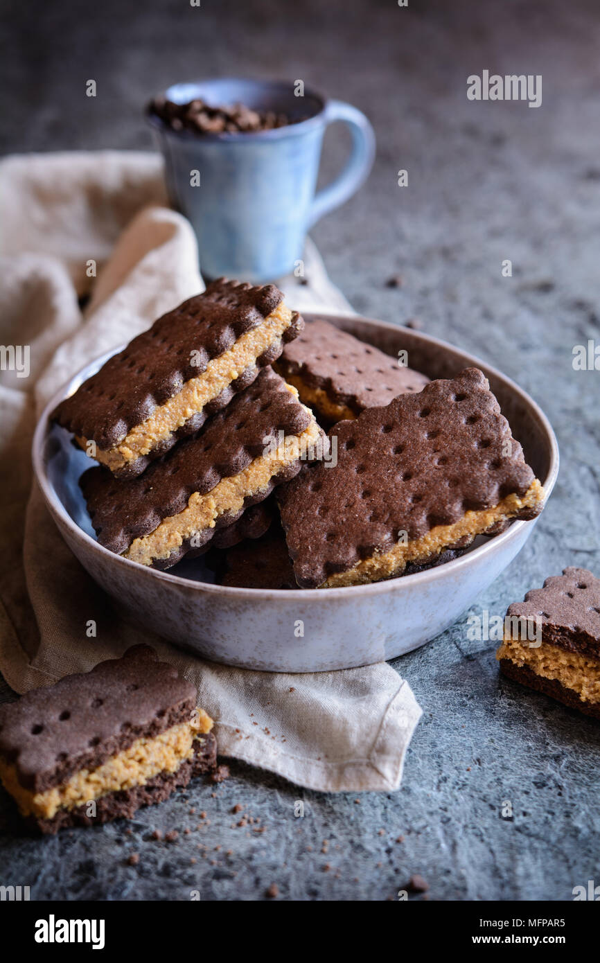 Delicious cocoa sandwich biscuits stuffed with walnut and coffee