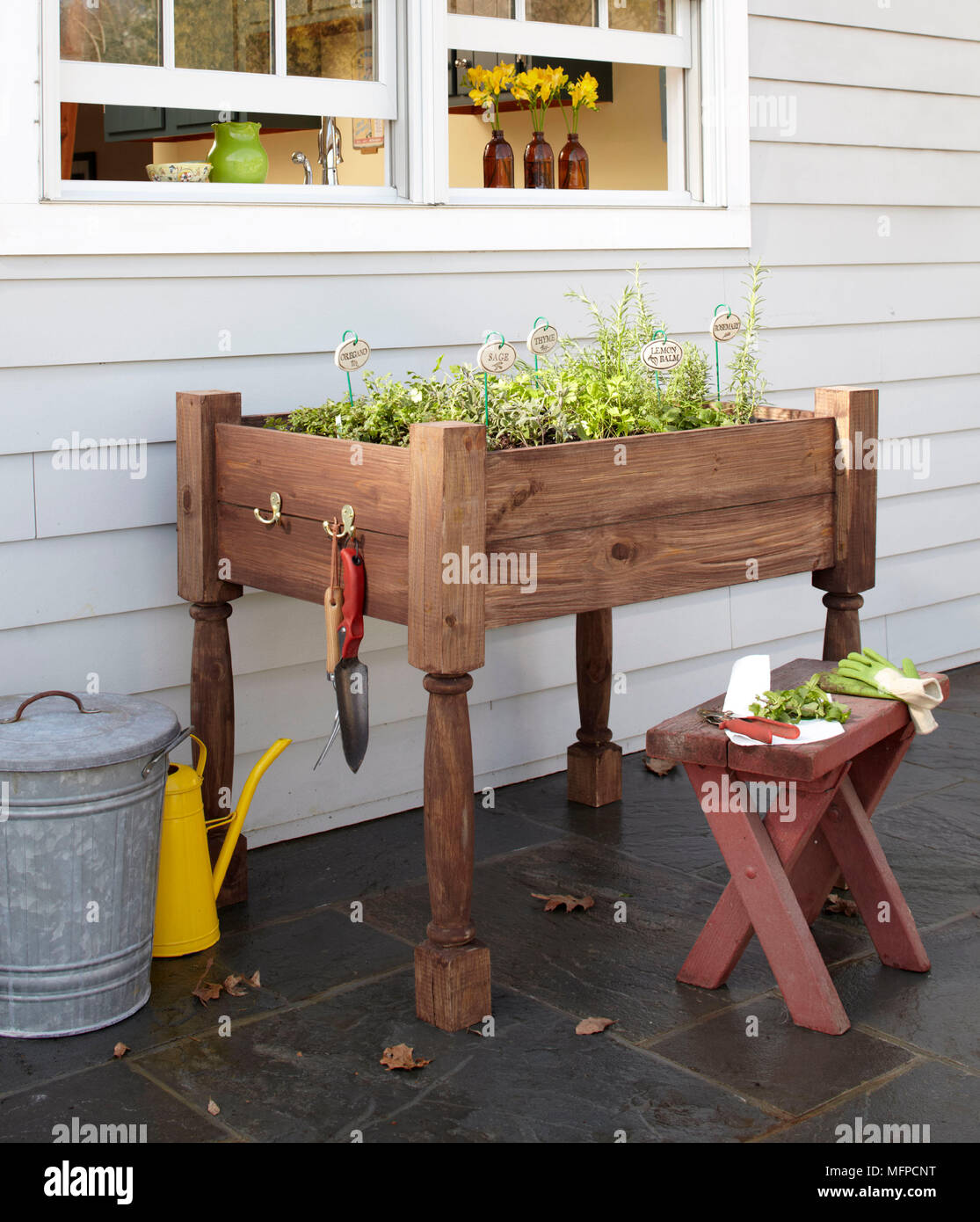 New York Usa Herbs Growing In Tray On Wooden Potting Bench With