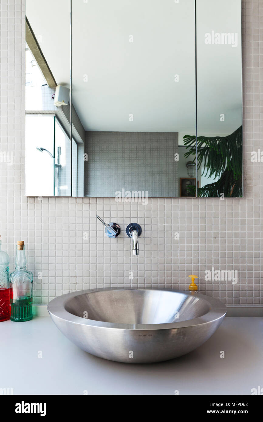 Round Steel Bowl Washbasin Beneath Mirror In Modern Bathrom New York Usa Stock Photo Alamy