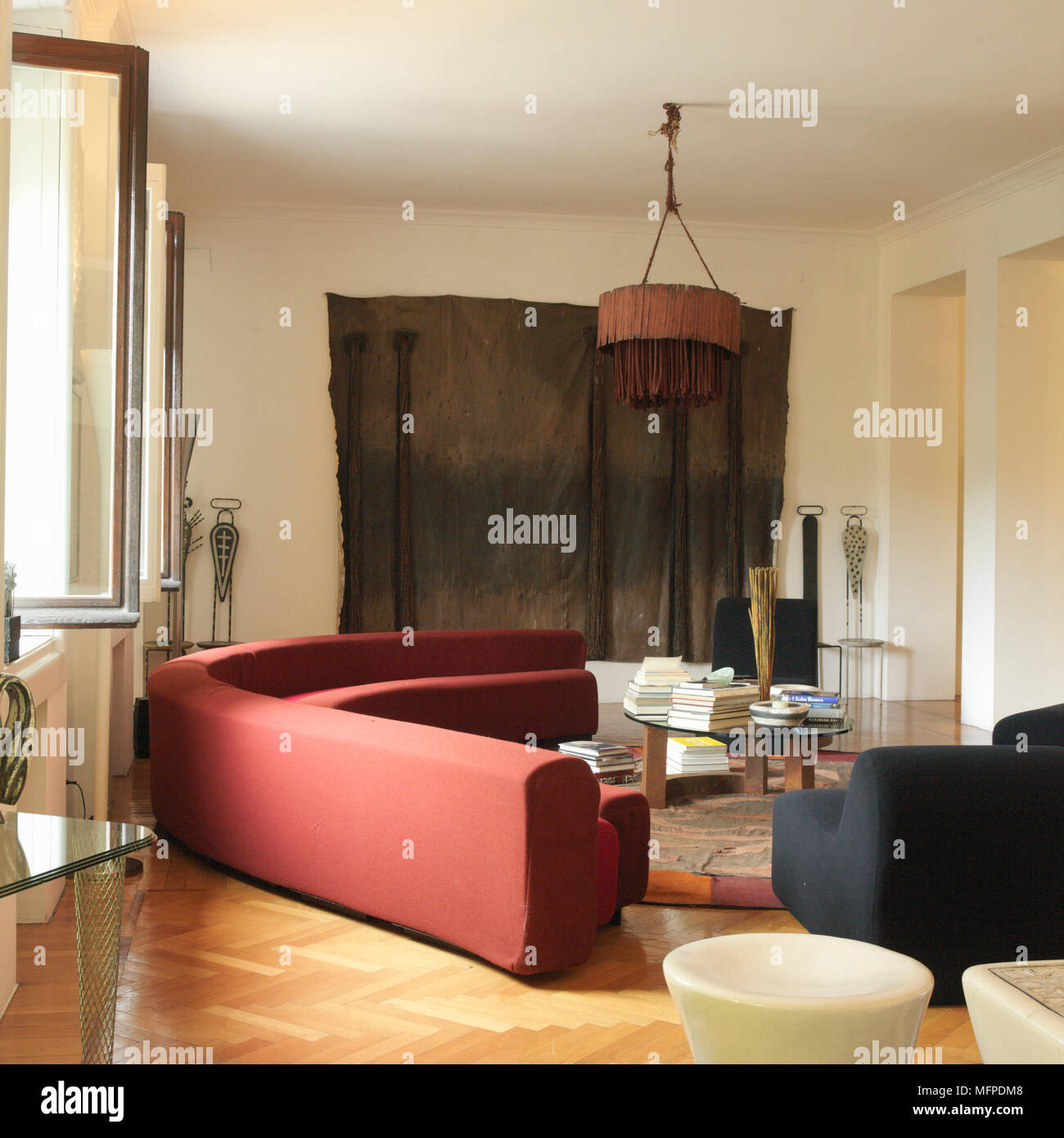 A Modern Sitting Room With High Ceiling Wood Flooring A