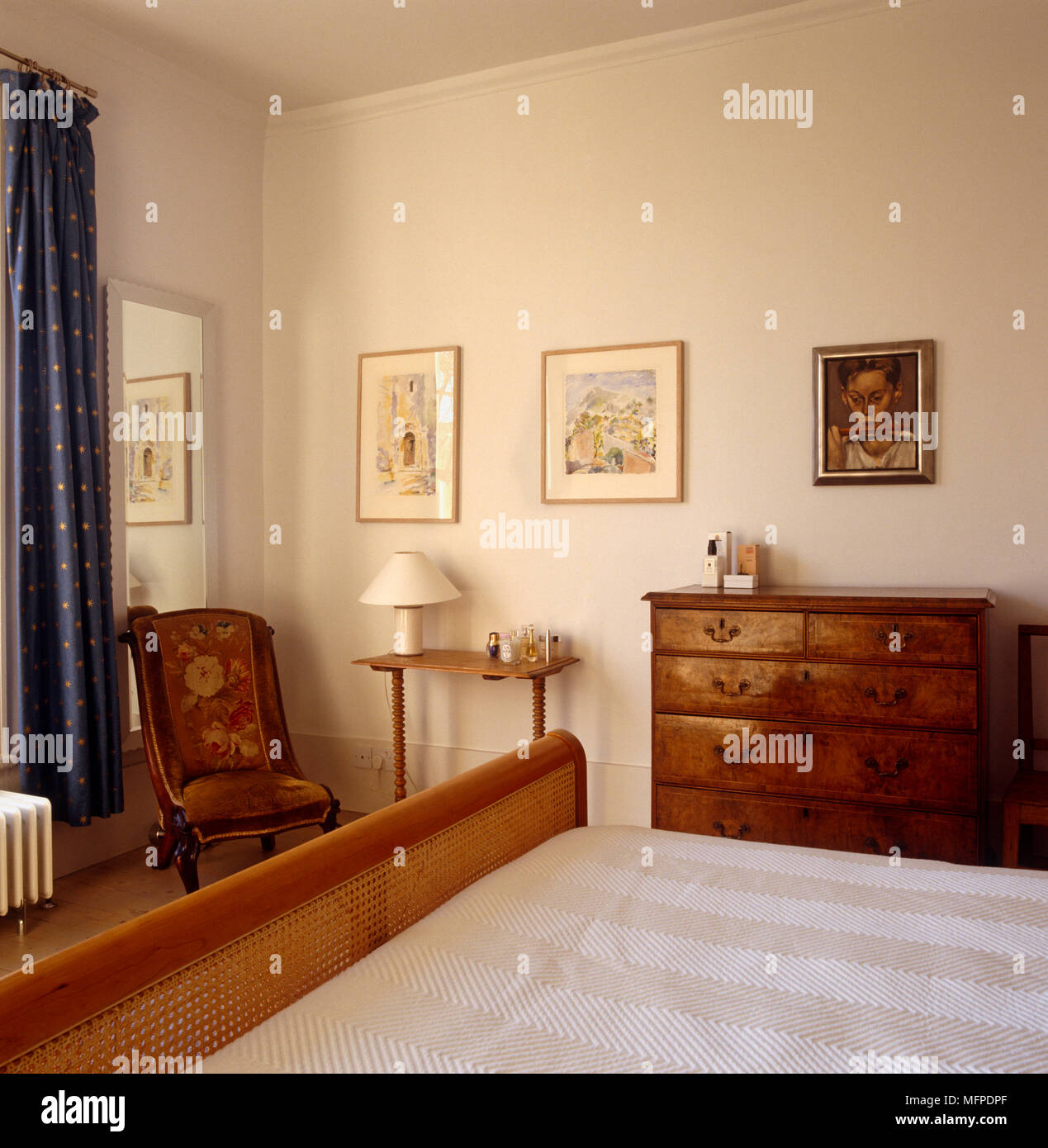 Country style bedroom with wooden bed and chest of drawers Stock Photo ...