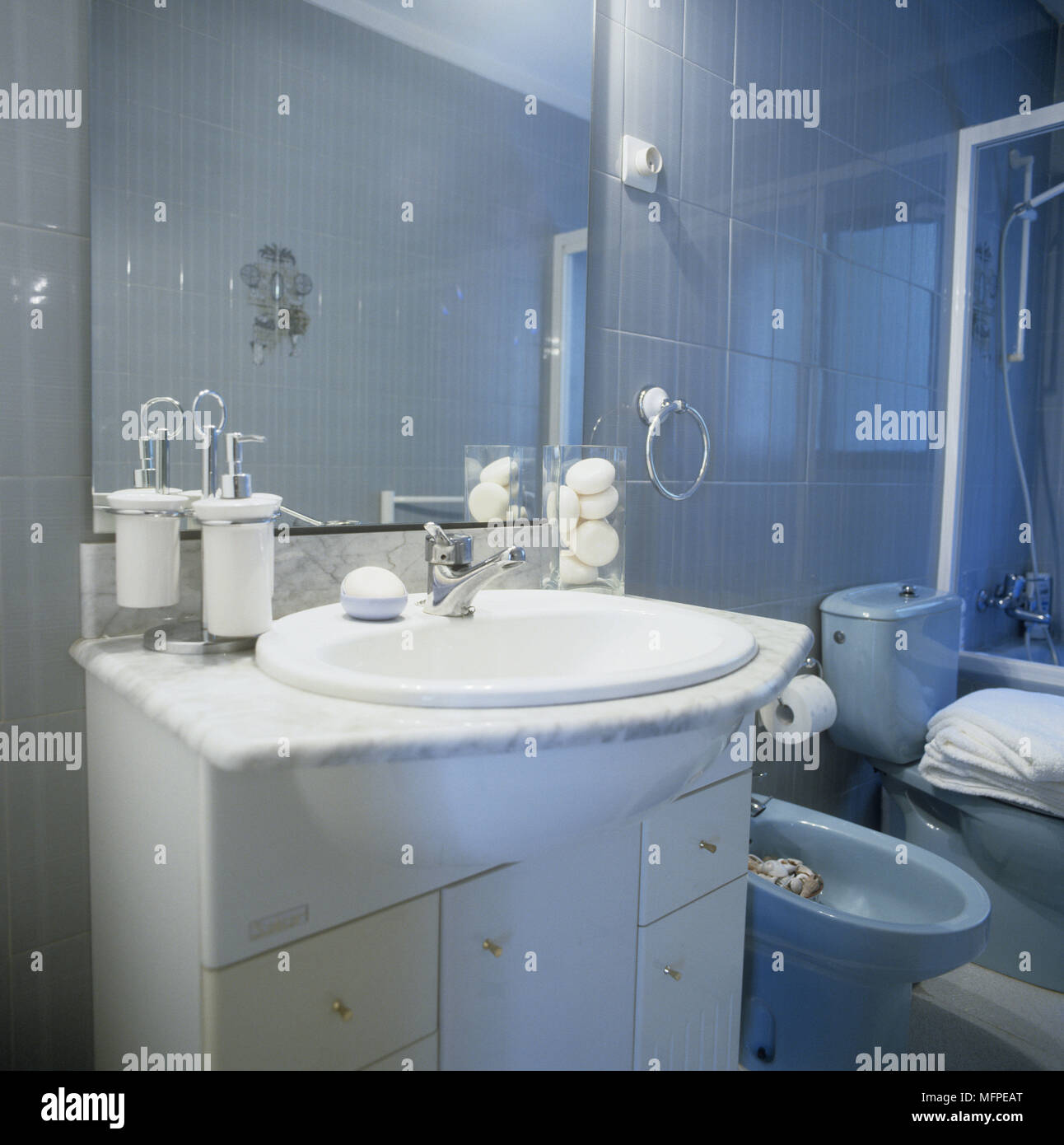Bathroom with a wash basin mounted on a storage cupboard Stock Photo ...