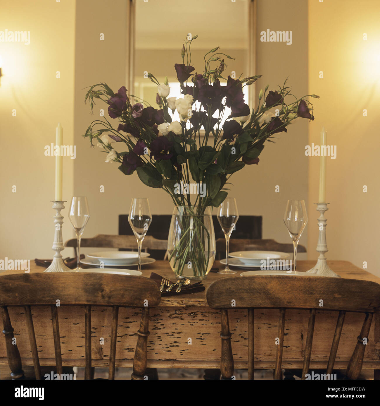 Detail Of Laid Table With Wine Glasses A Big Bunch Of Flowers In A