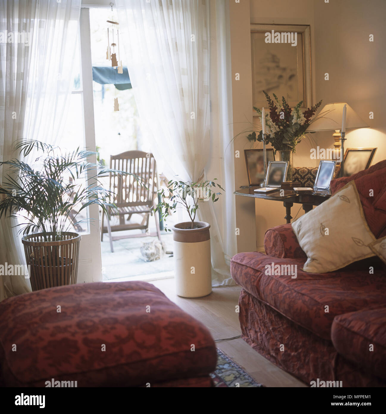 Traditional Sitting Room By French Doors With Light From Lamp On