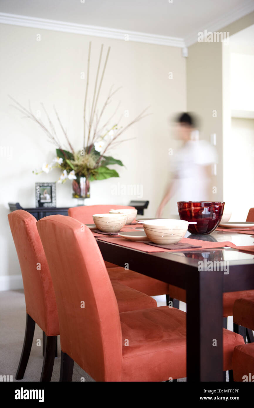 Blurred image of owner in dining room Stock Photo