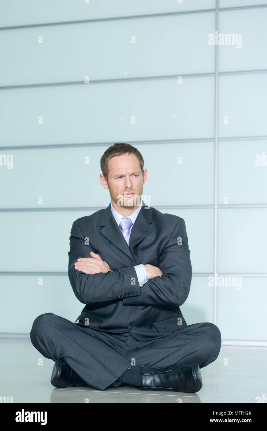 Businessman sitting on the floor with his arms crossed Ref: CRUSC 10020 ...