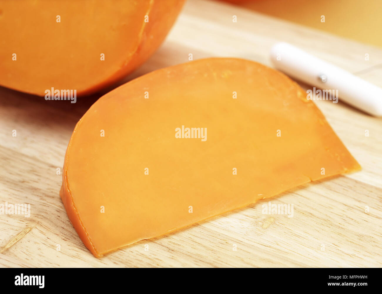 French Cheese called Mimolette, Cheese made from Cow's Milk Stock Photo