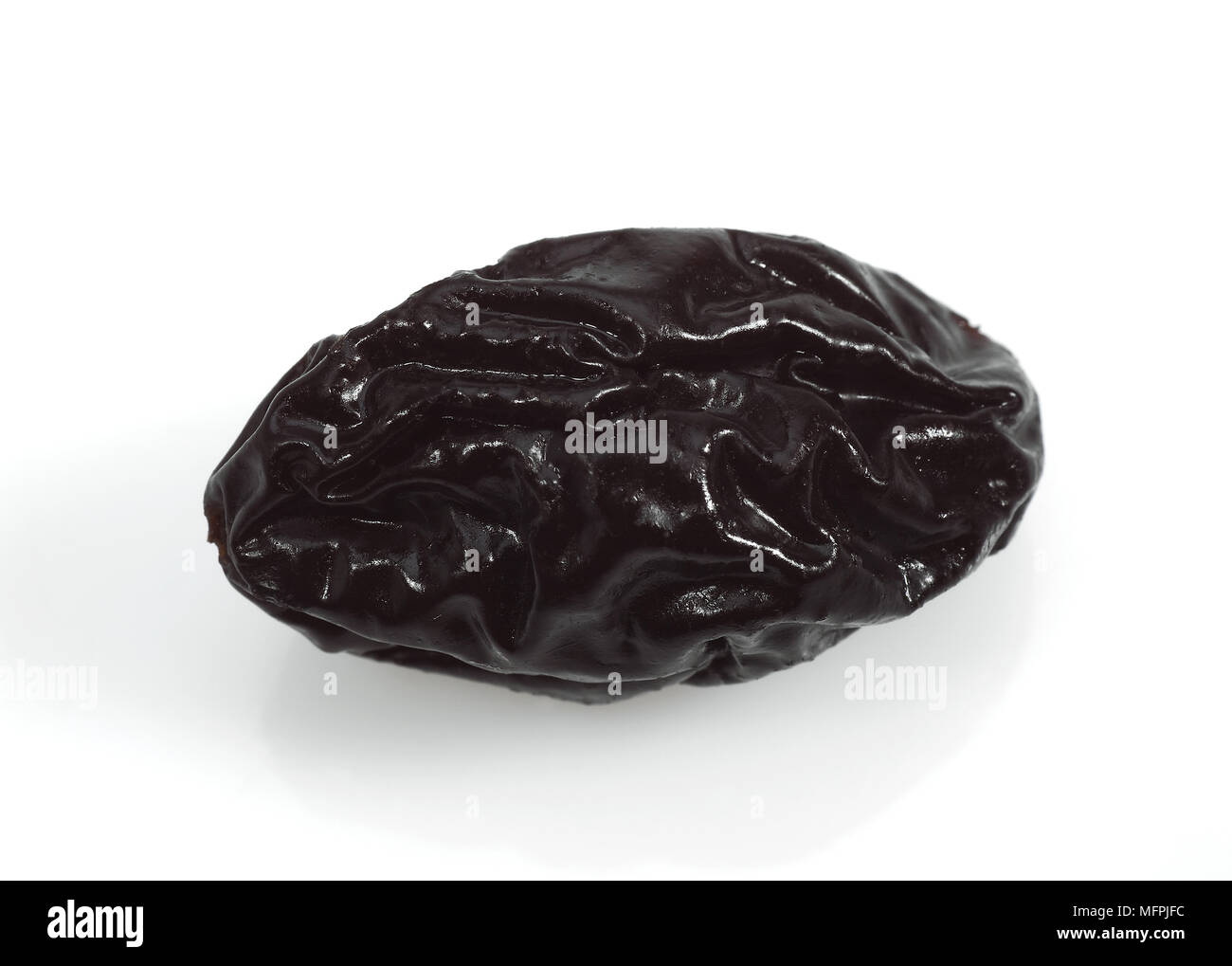 Dry Prunes against White Background Stock Photo Alamy