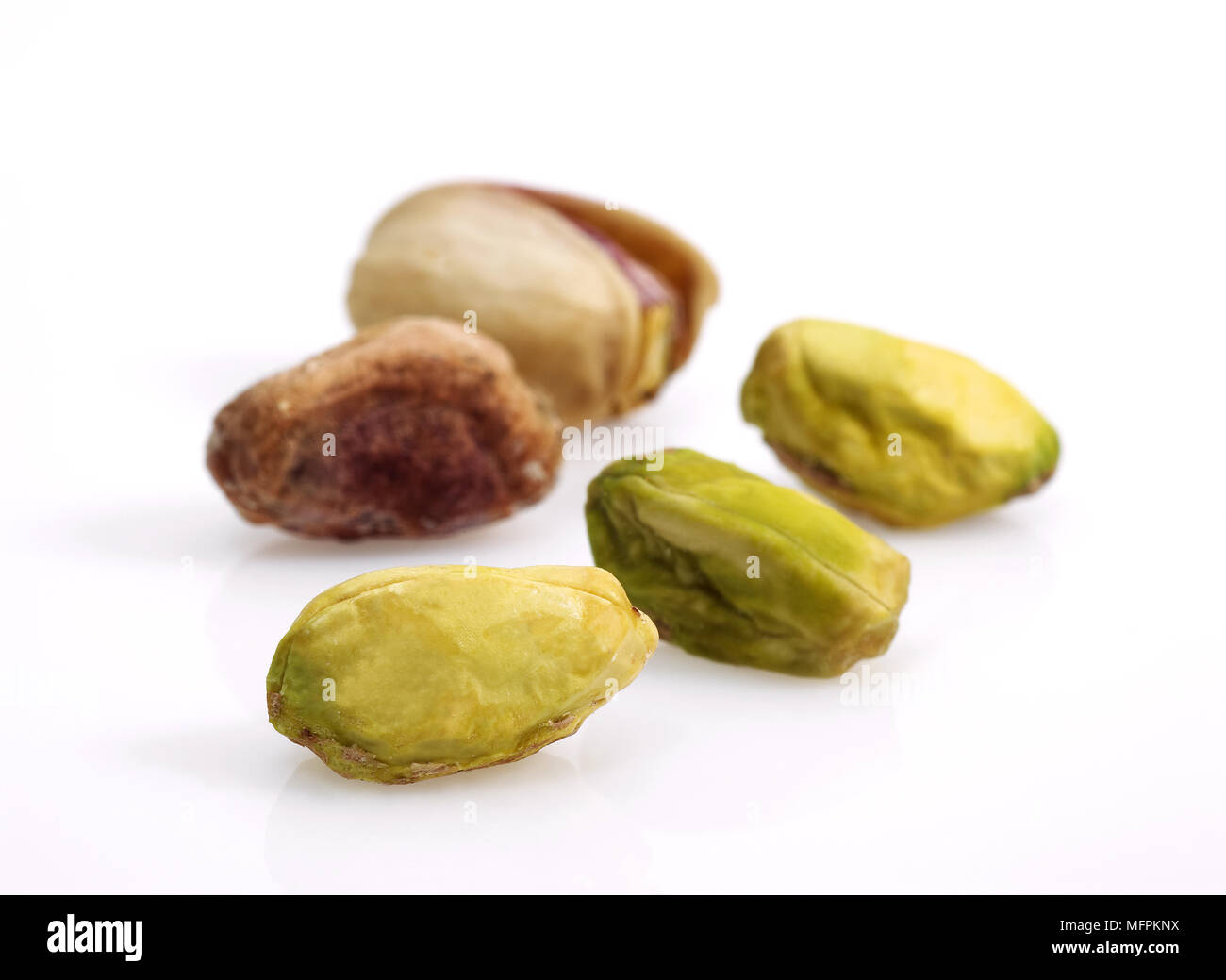 Pistachio Nuts, pistacia vera, Dry Fruits against White Background