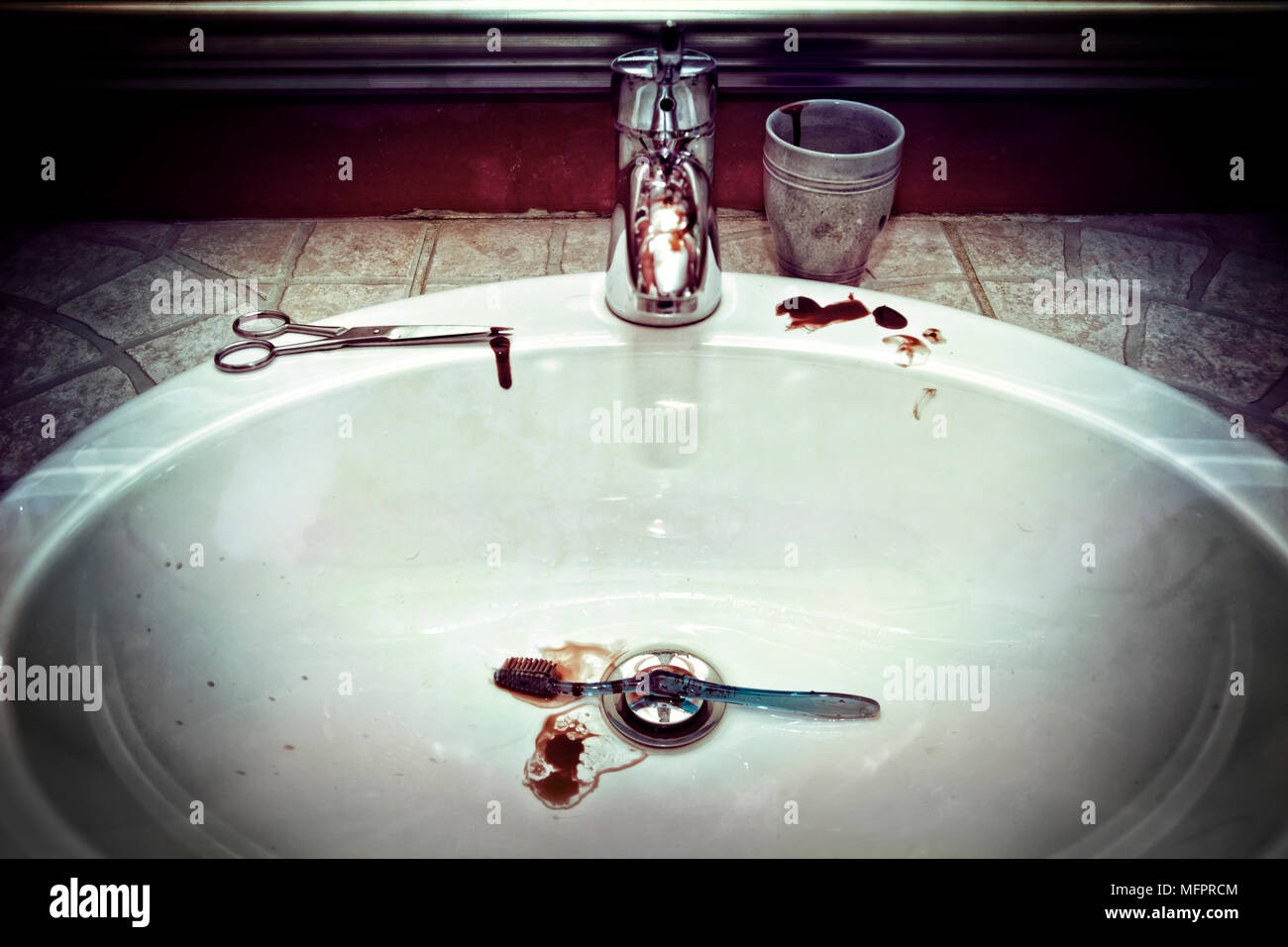 Sink and tap water, brush and scissors with blood stains Stock Photo