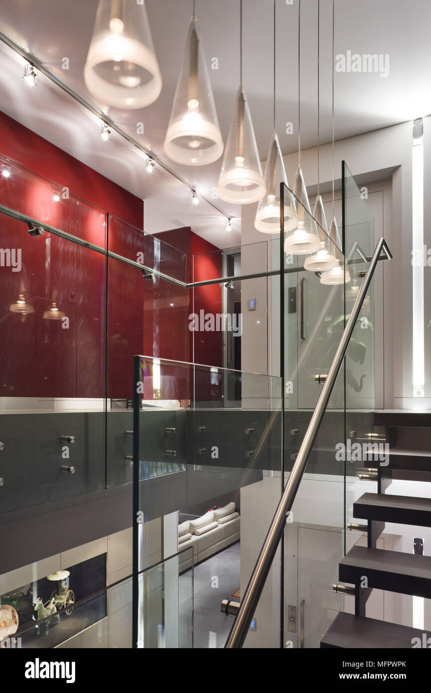 Ceiling Lights Suspended Above Modern Staircase Stock Photo