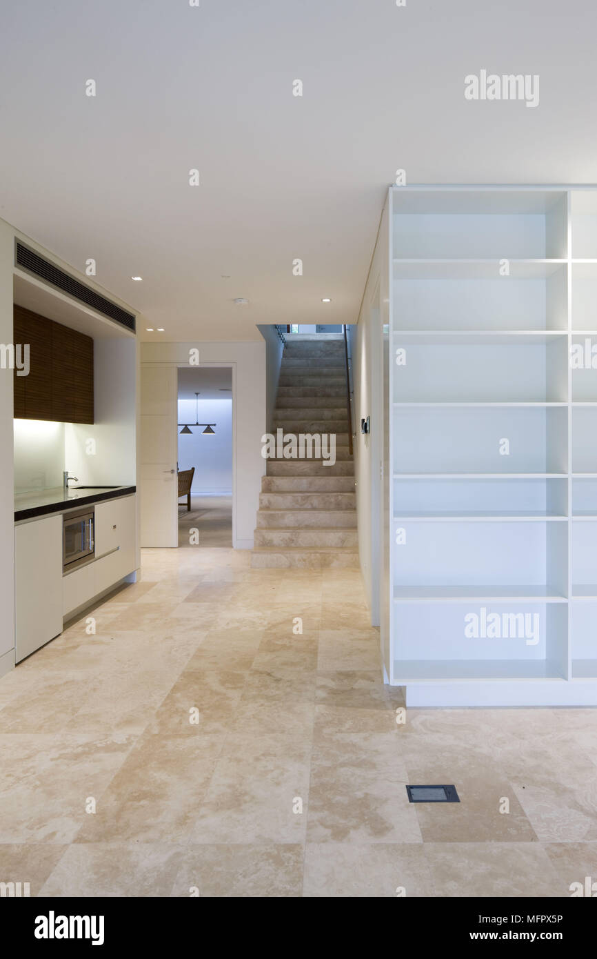 Modern open plan kitchen with tiled floor Stock Photo Alamy