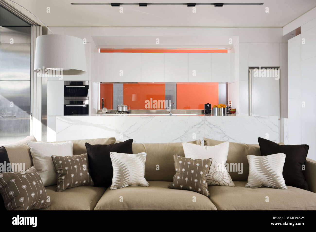 Modern open plan room with kitchen and sitting area Stock Photo - Alamy