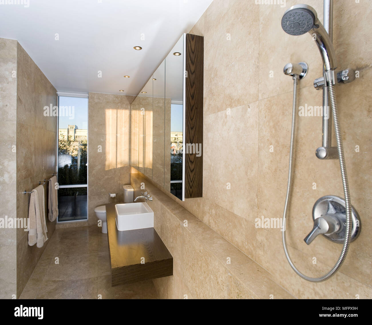 Shower Tap Fitting In Modern Wet Room Bathroom With