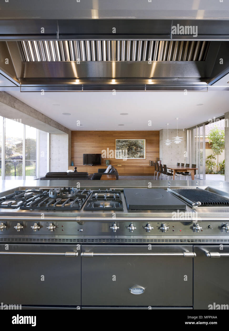 Stainless steel range oven with extractor fan in modern open plan kitchen Stock Photo Alamy