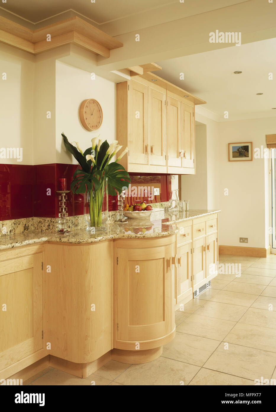 Kitchen with fitted units and tiled floor Stock Photo