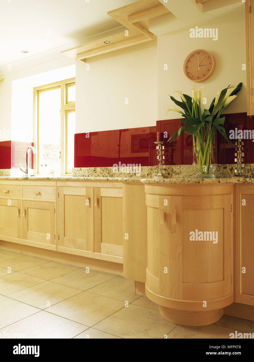 Kitchen with fitted units and tiled floor Stock Photo