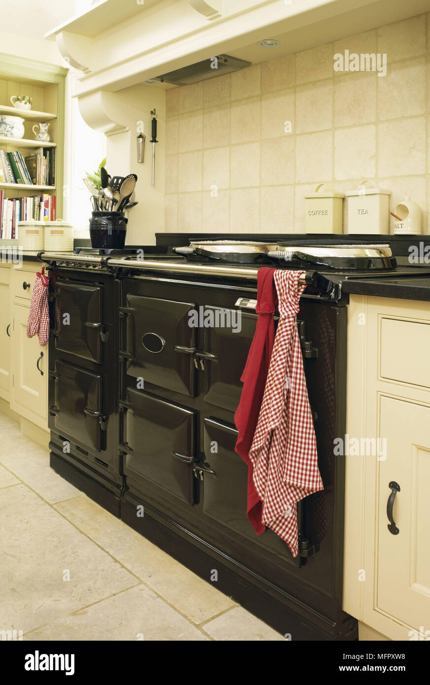 Range oven in country style kitchen with fitted units Stock Photo Alamy