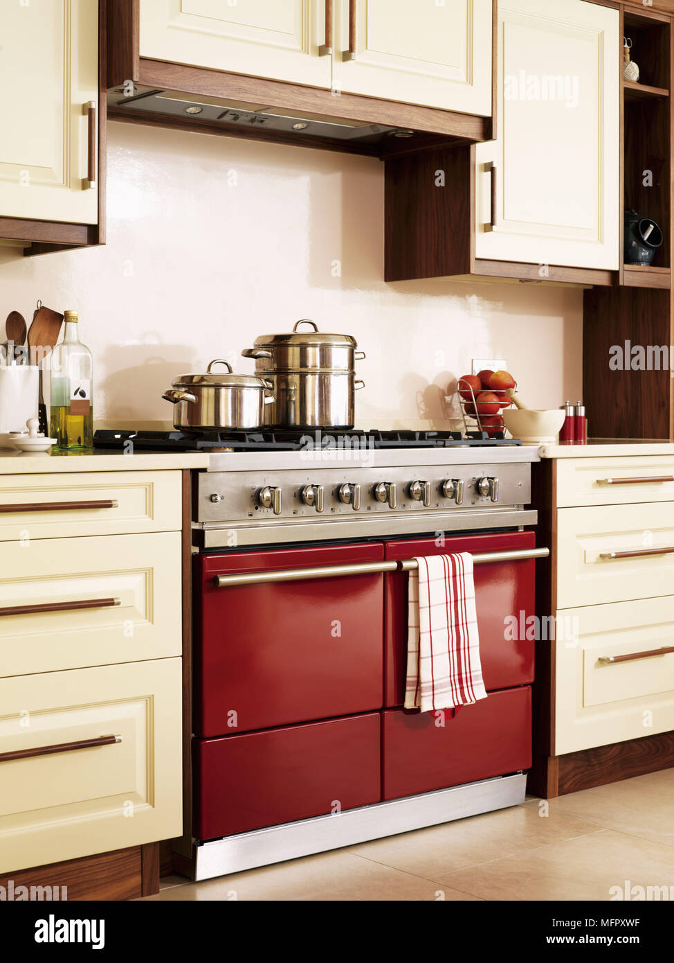 Red Range Oven In Contemporary Kitchen With Fitted Units Stock Photo Alamy