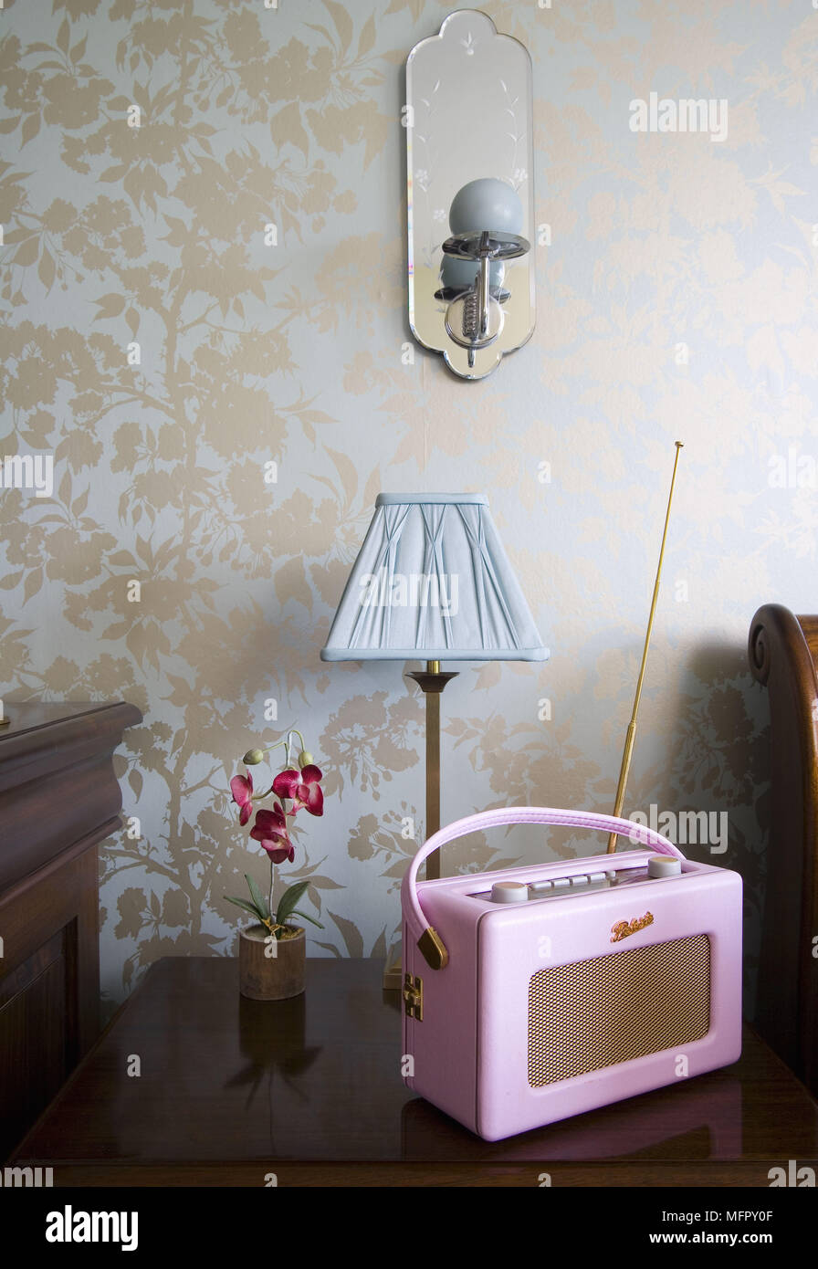 Lamp on bedside table in traditional style bedroom Stock Photo Alamy