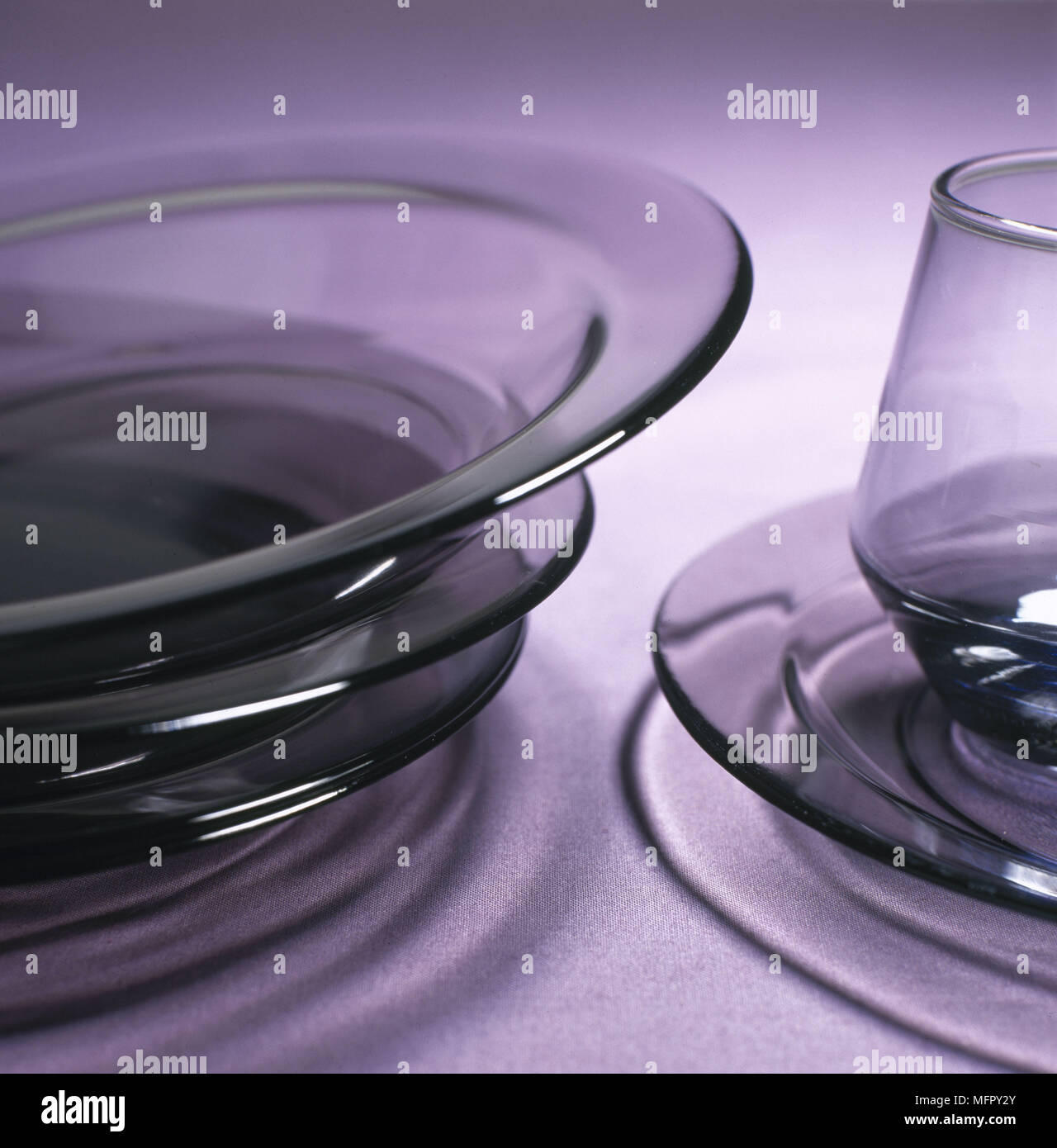 Modern purple glass dishes Stock Photo - Alamy