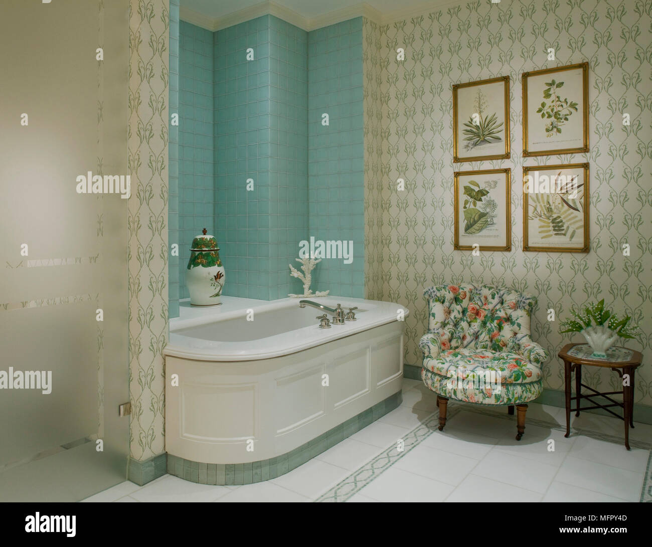 Upholstered chair next to bathtub in traditional style bathroom Stock ...