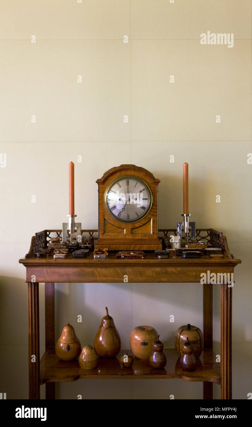 Clock and candlesticks on traditional style table Stock Photo