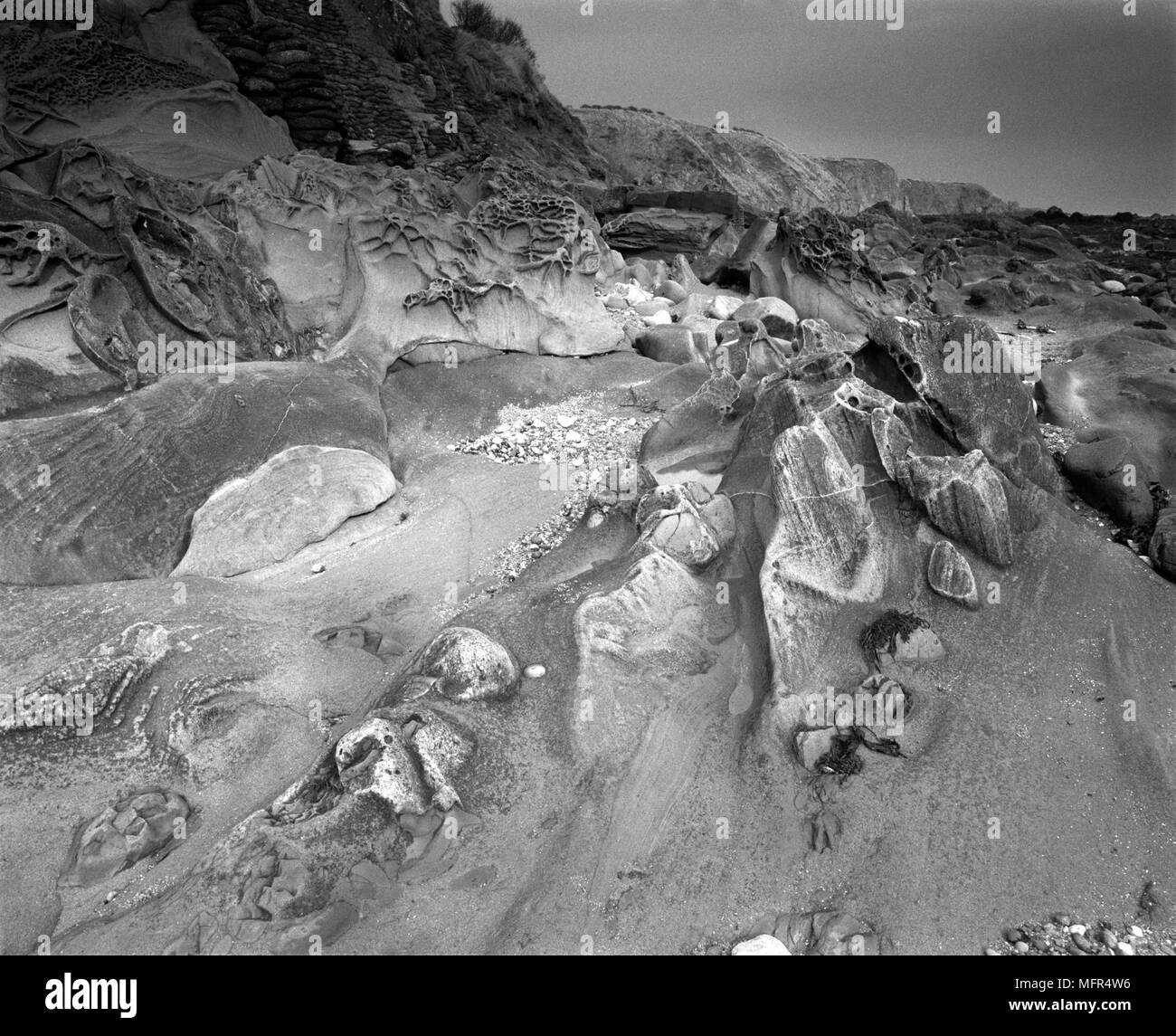 Black and white view of the rock shore formation in Cowie, Stonehaven ...