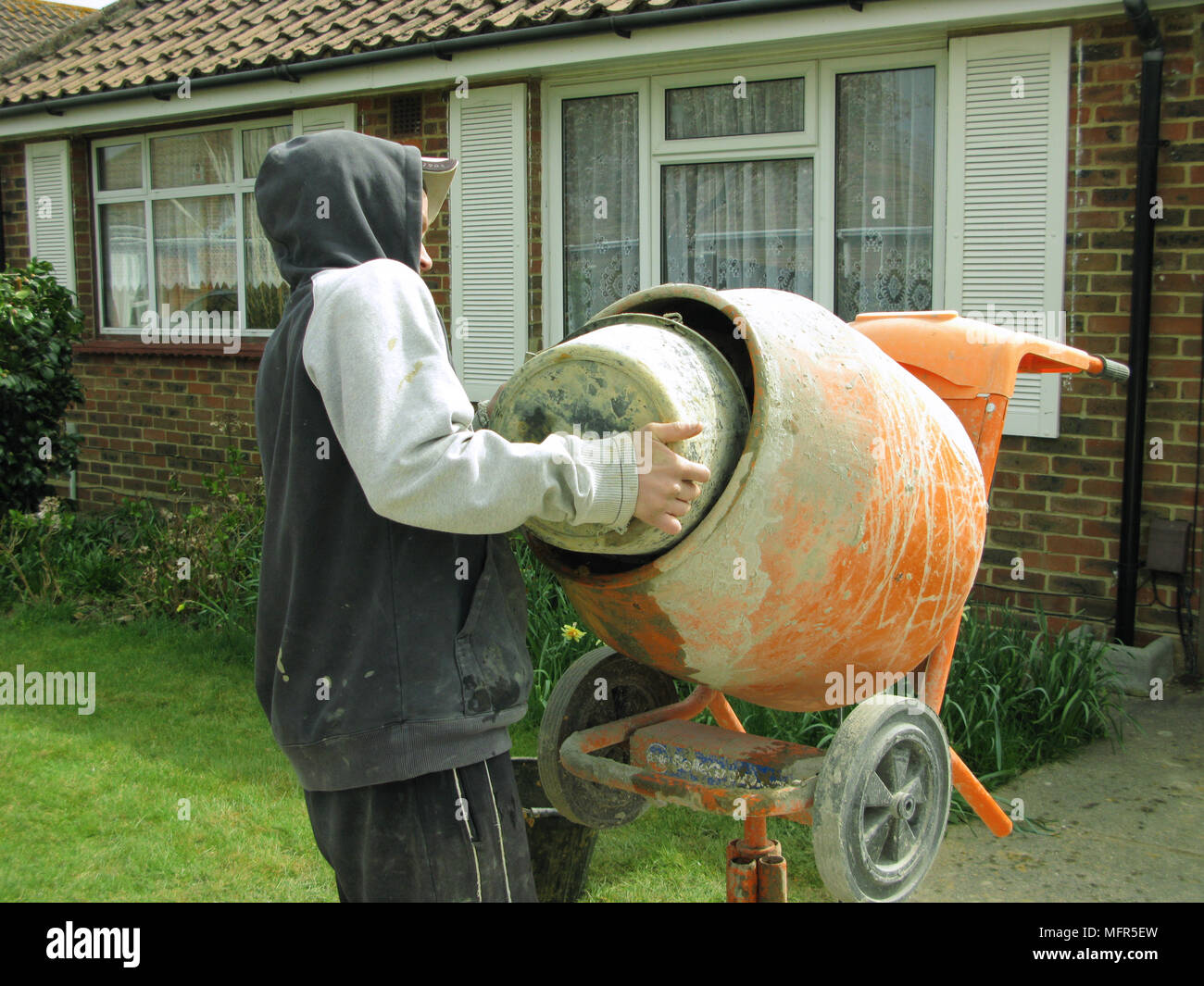 Mixing cement in a bucket hires stock photography and images Alamy