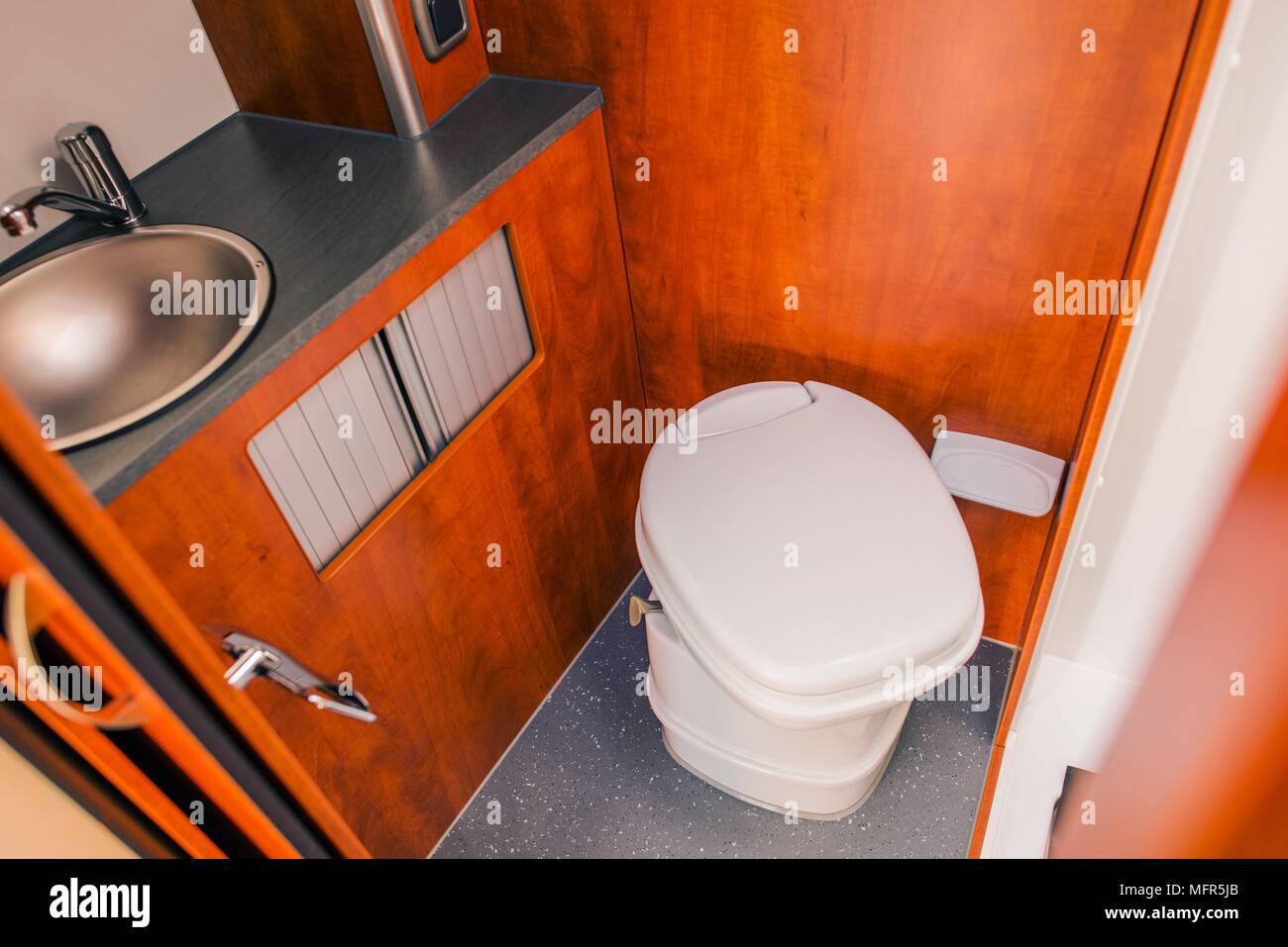Elegant Camper RV Bathroom with Cassette Toilet. Rving in Style. Stock Photo