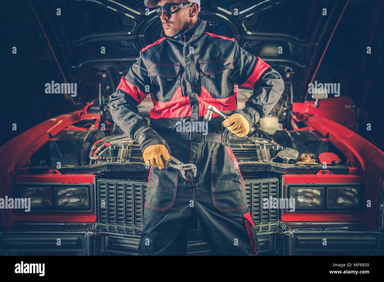 Vintage Classic Car Mechanic. Caucasian Professional Mechanic in Front