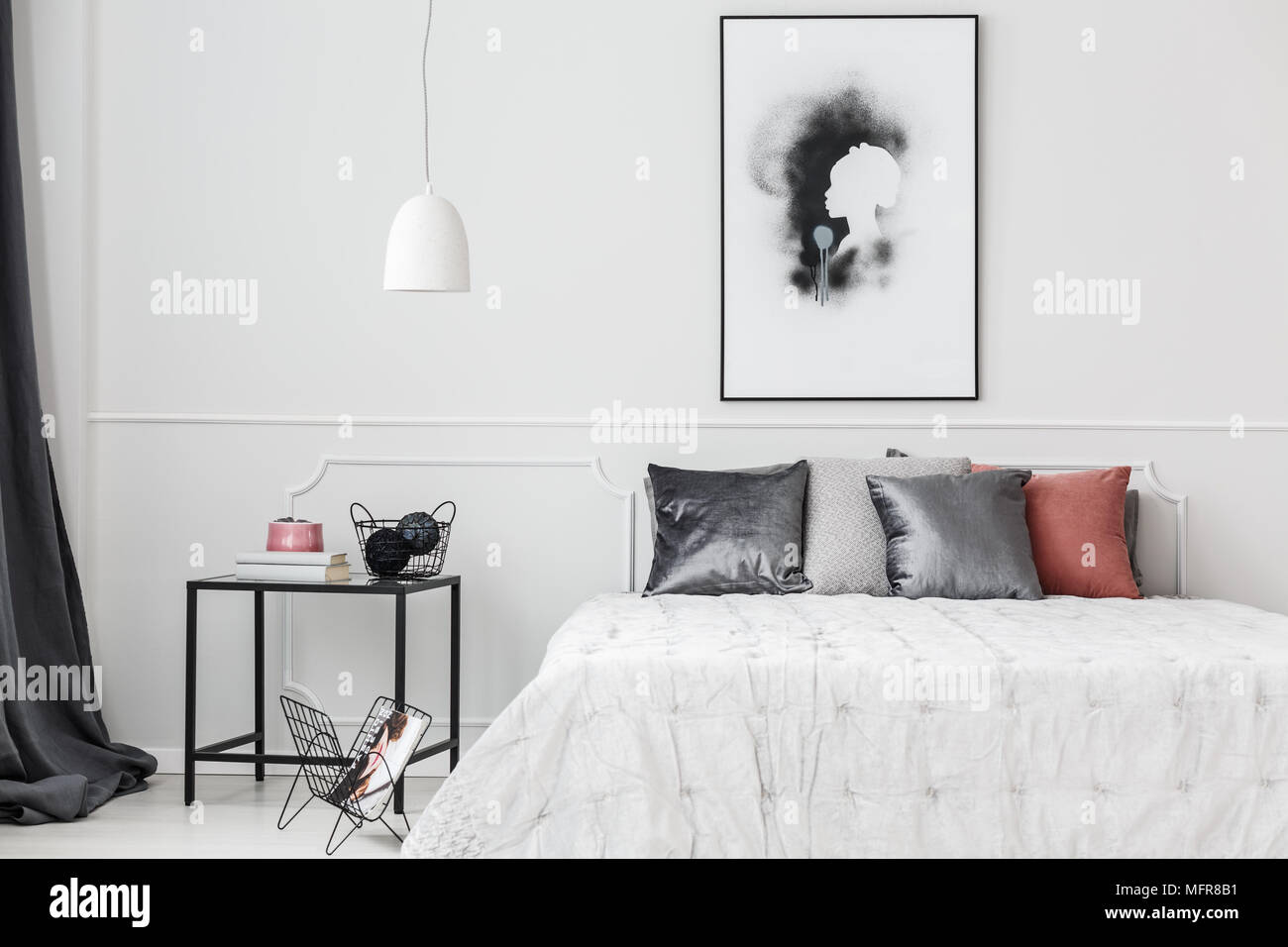 Simple Elegant Bedroom Interior With Silver Cushions On