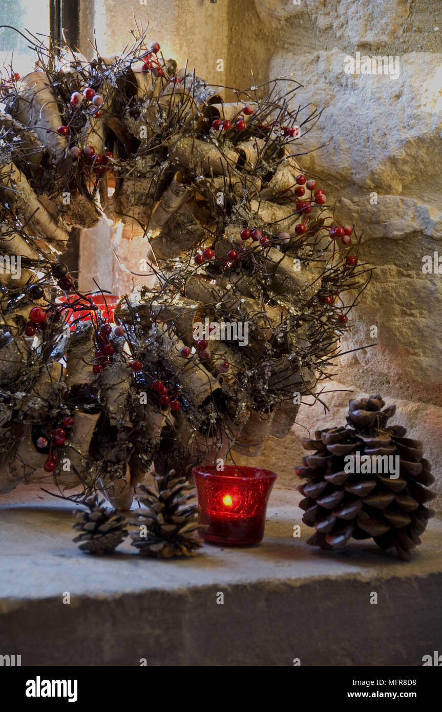Christmas Wreath With Lit Candles On Window Sill Stock Photo Alamy