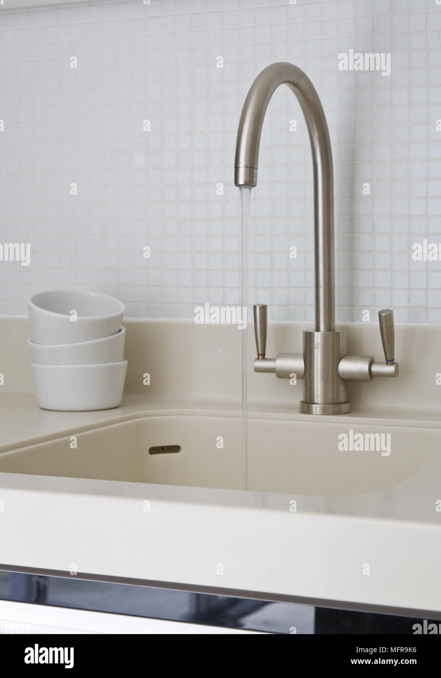 Contemporary tap fitting on neutral colour kitchen sink Stock Photo Alamy