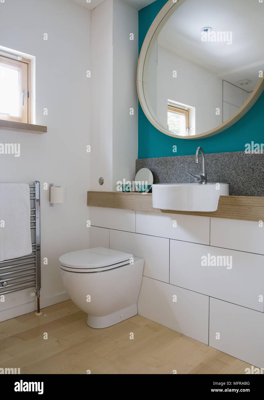 Washbasin set in built in shelf with low level toilet cistern