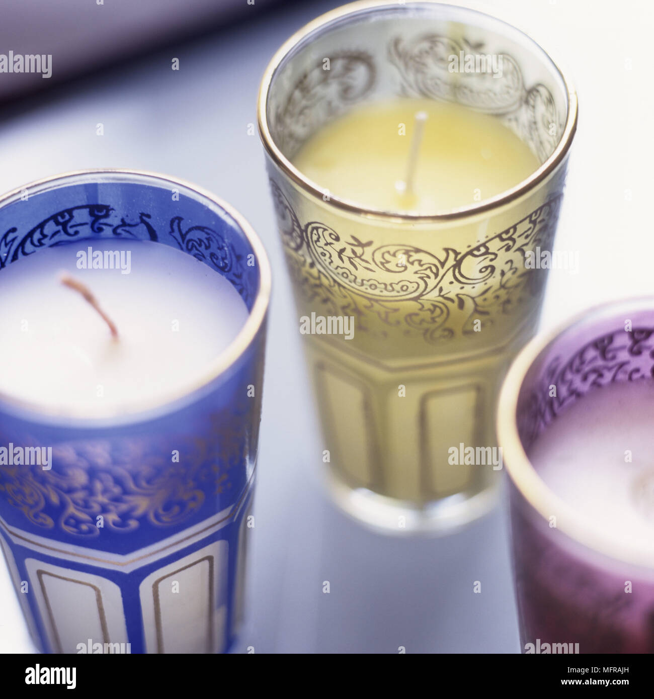 Candles in Moroccan tea glasses. Stock Photo