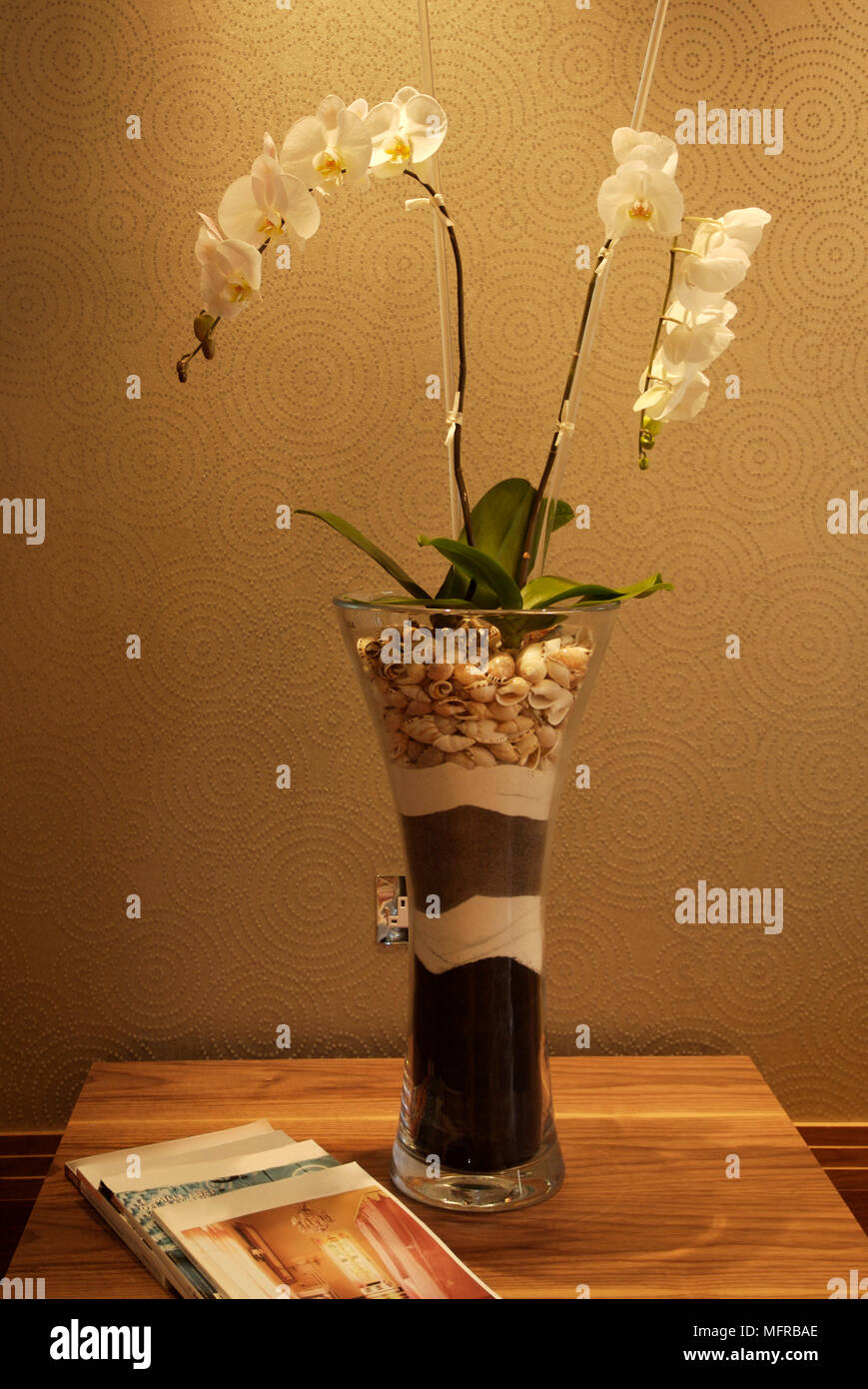 Glass vase of flowers on wooden surface Stock Photo Alamy