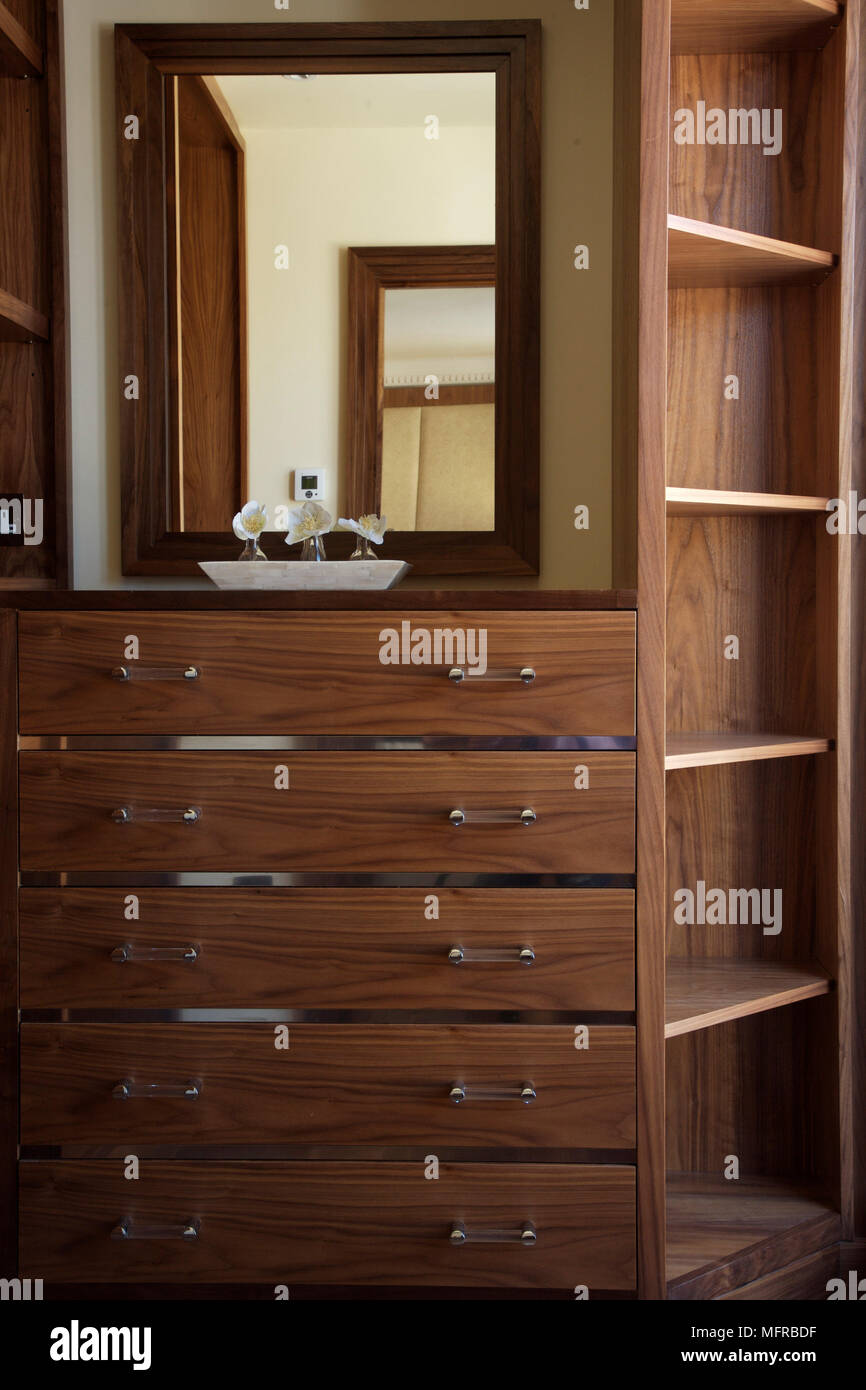 Wooden Cabinet With Shelves And Drawers Below Mirror Stock Photo