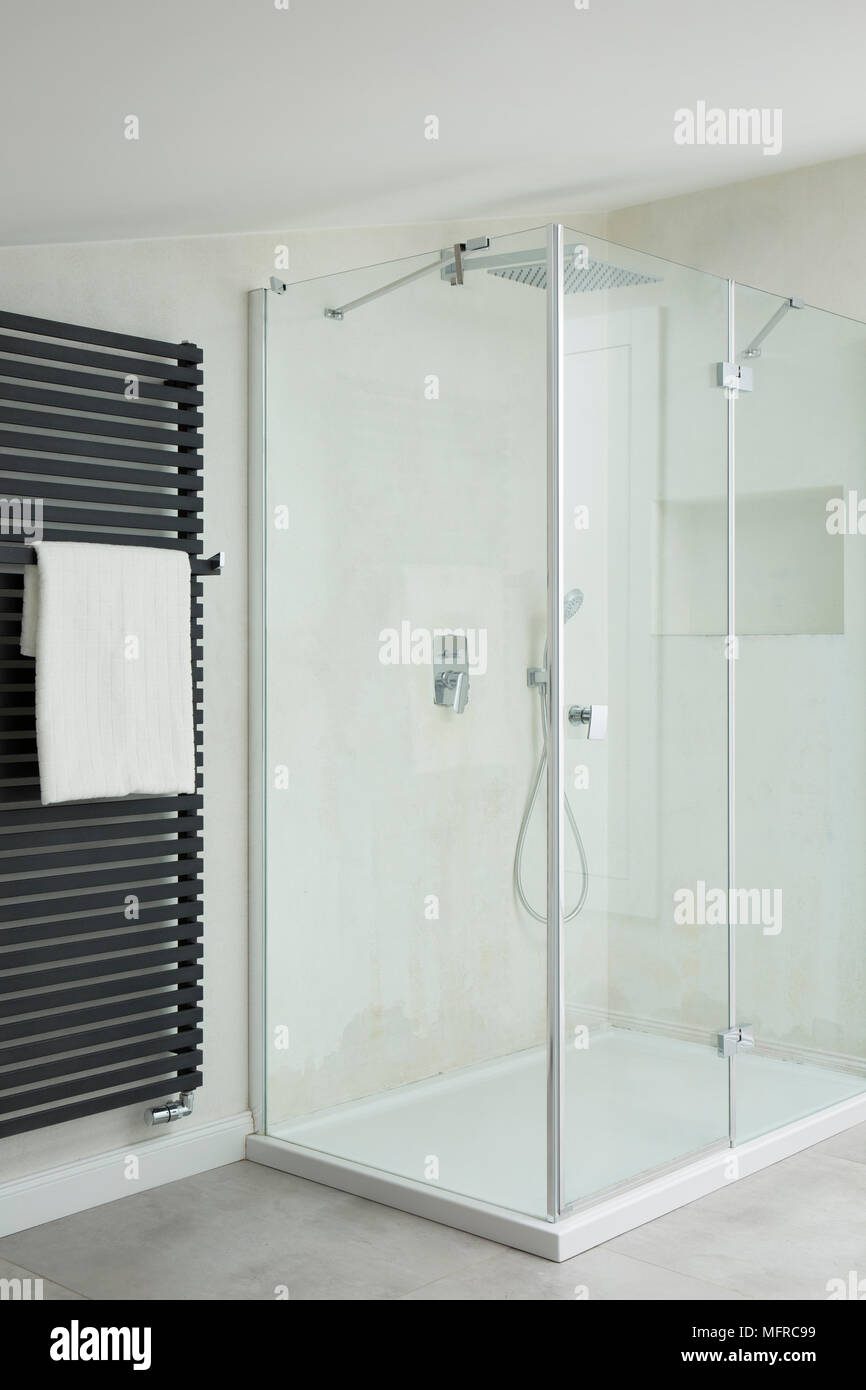 White, glass shower in clean, modern bathroom interior Stock Photo