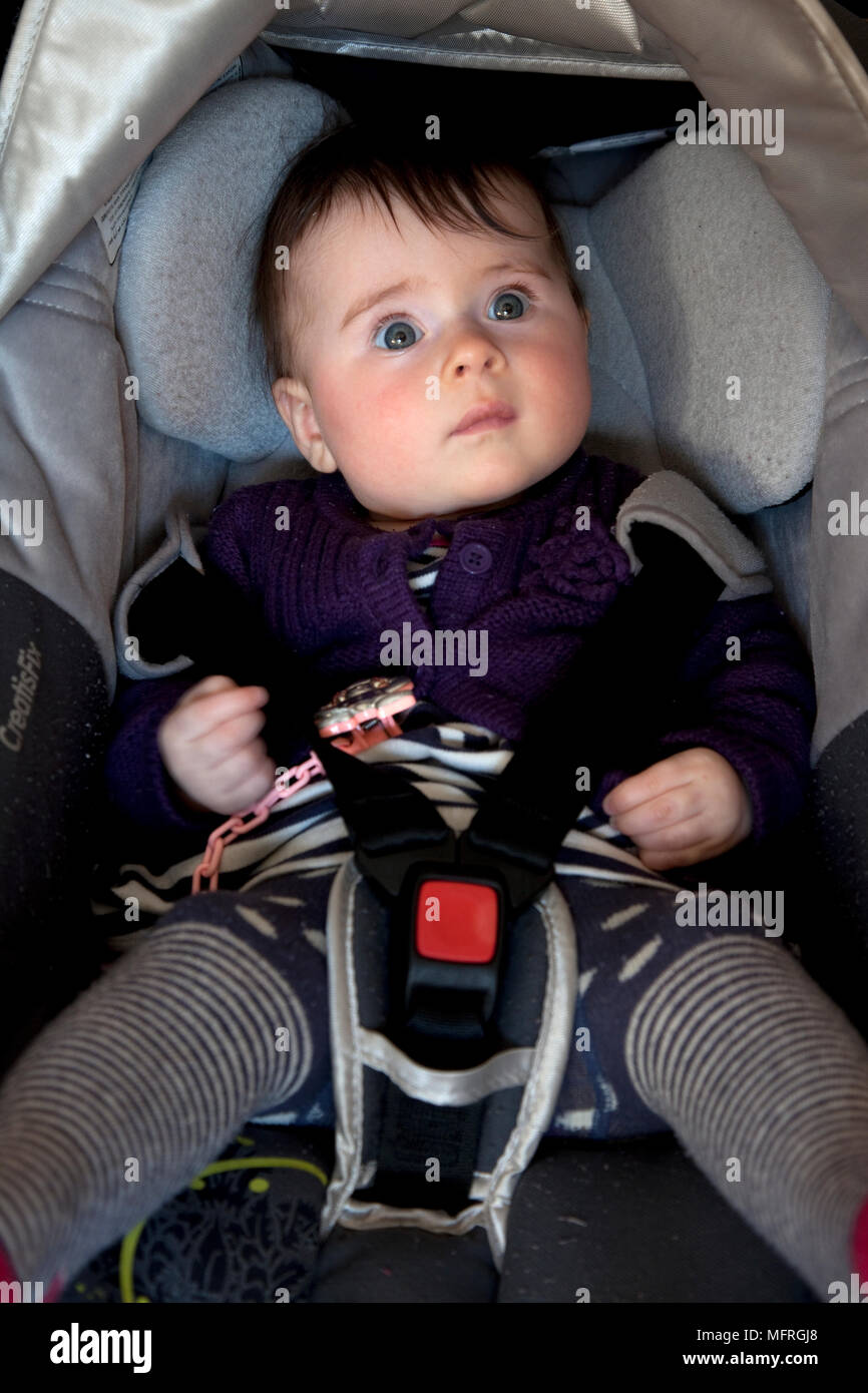 Baby in car seat strapped hires stock photography and images Alamy