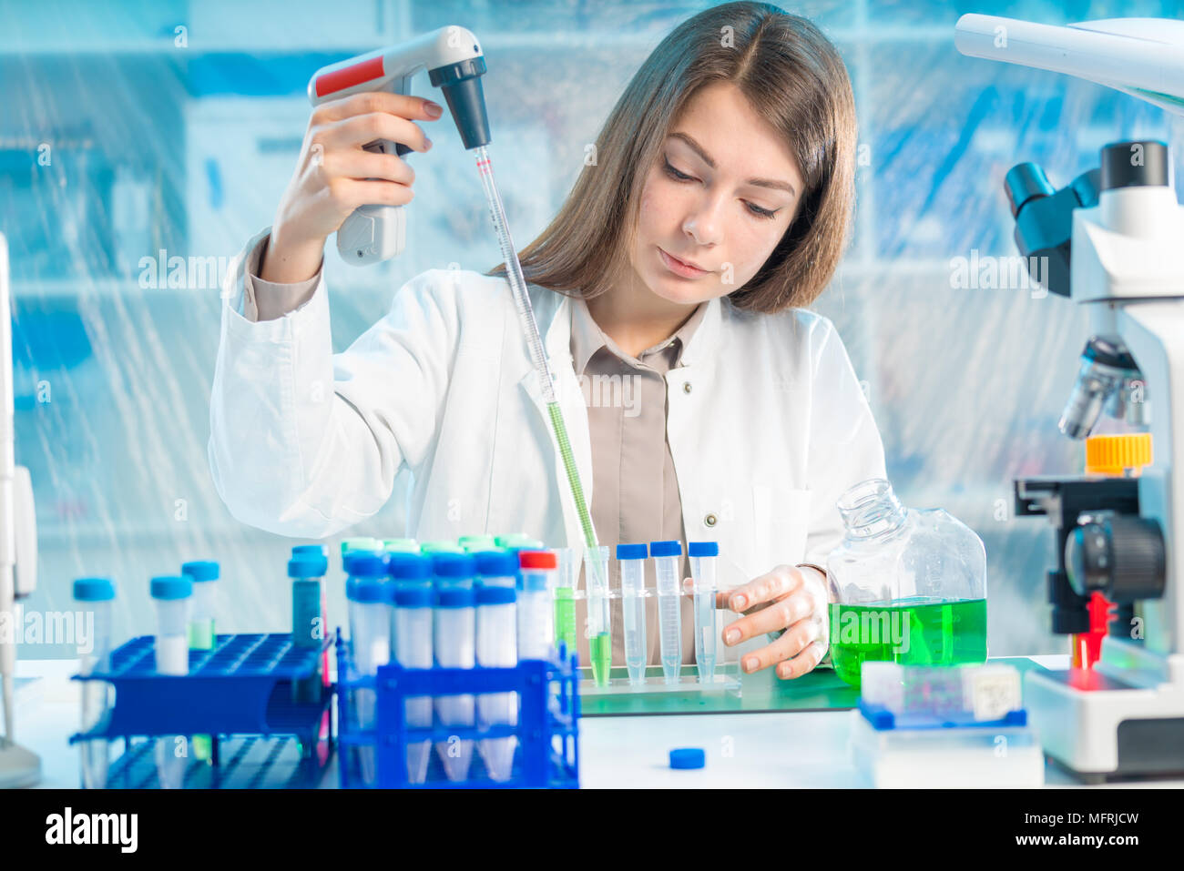 Chemical laboratory scientist woman working with pipette Stock Photo ...