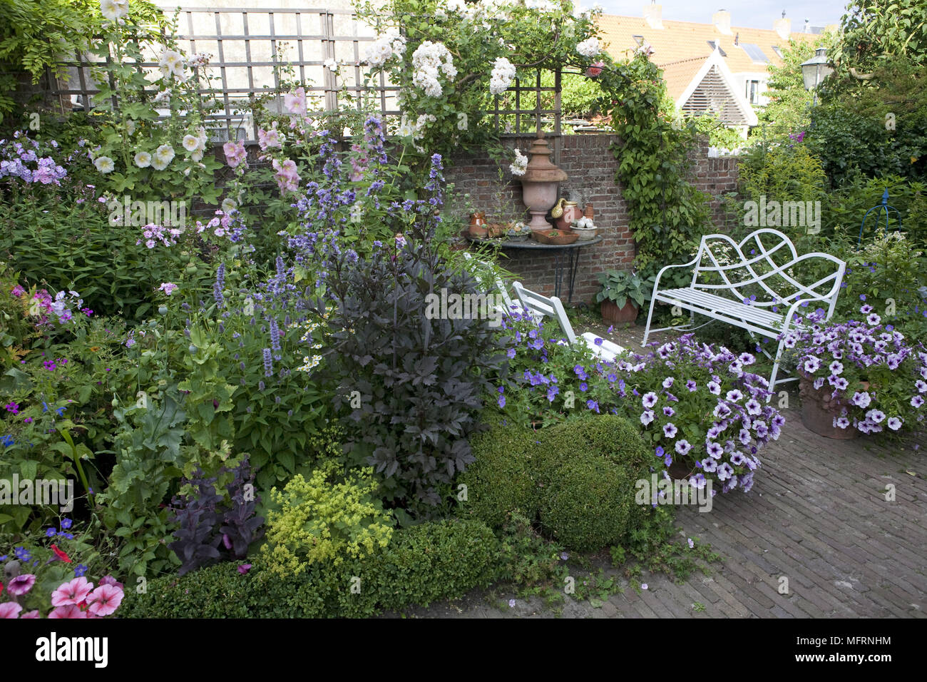Seating on patio area of garden Stock Photo