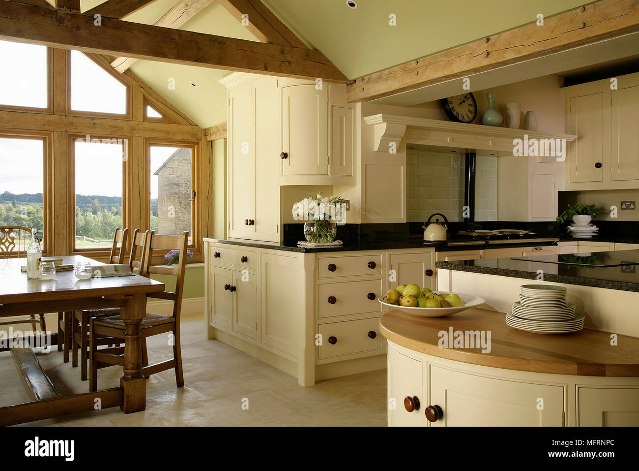 Dining tale and chairs in modern country style kitchen with neutral