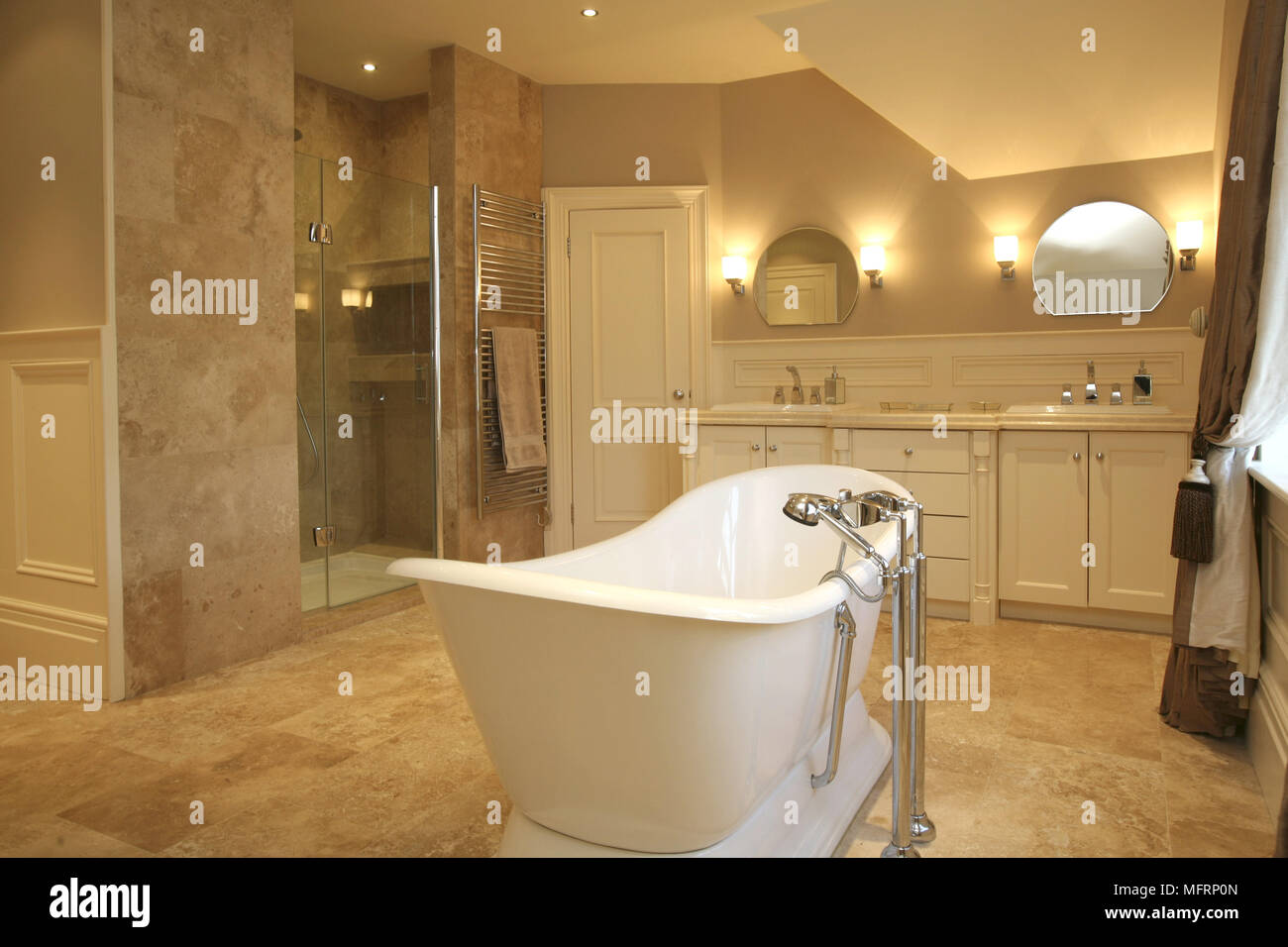 Freestanding bathtub in traditional style bathroom Stock Photo Alamy