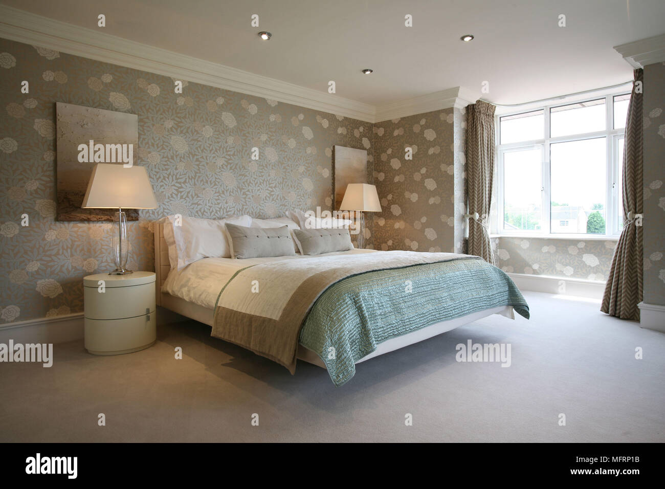 Lamps On Bedside Table Either Side Of Double Bed In
